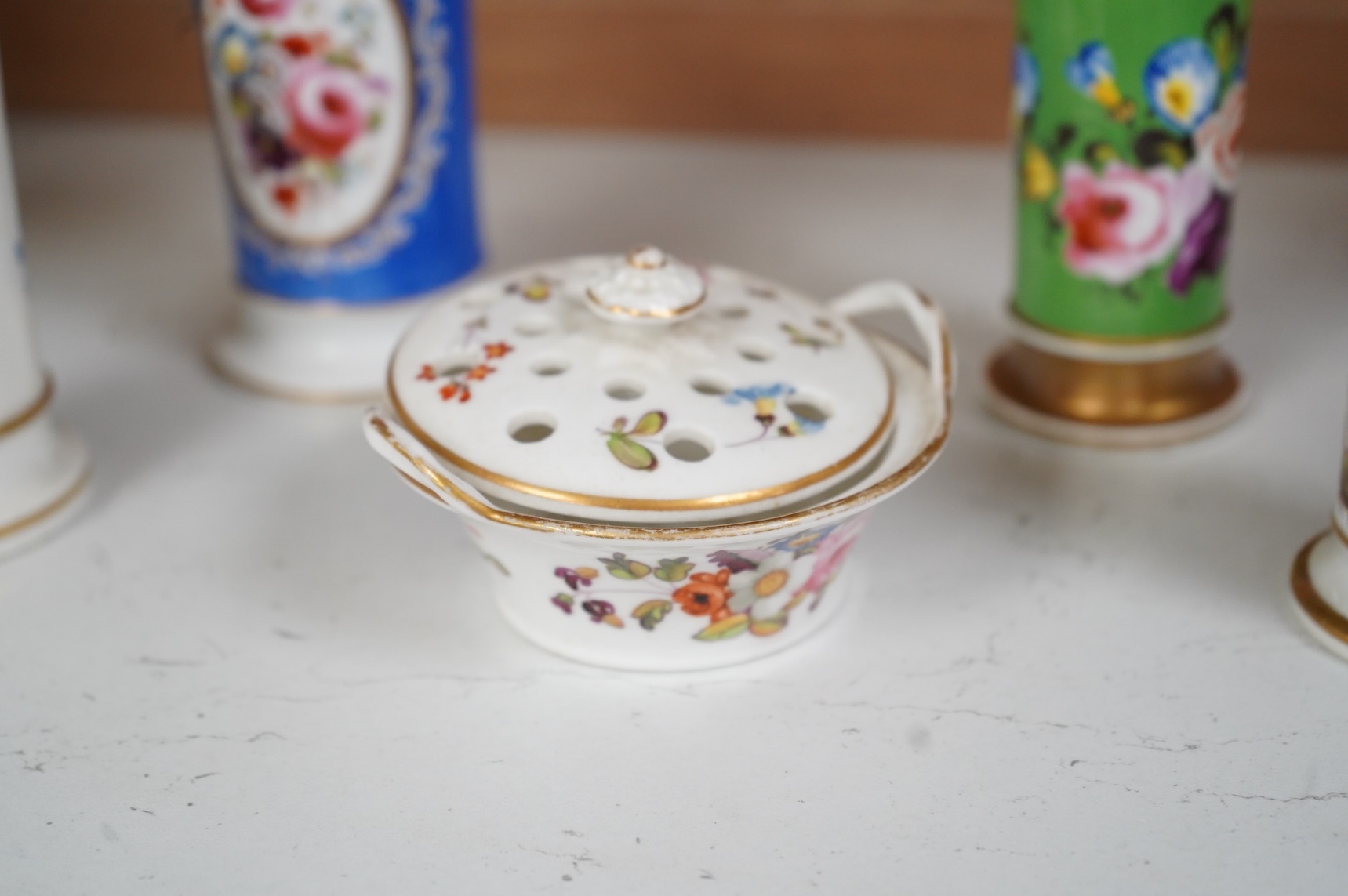An early 19th century English porcelain miniature pot pourri basket and cover and three spill vases decorated with birds and flowers, largest 11cm high